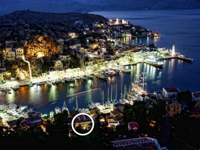 a view of a harbor at night at The Old Markets in Symi