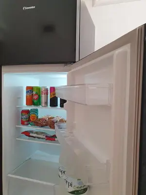 an open refrigerator with food inside of it at Yiannis Sokaki detached House in Rhodes Town