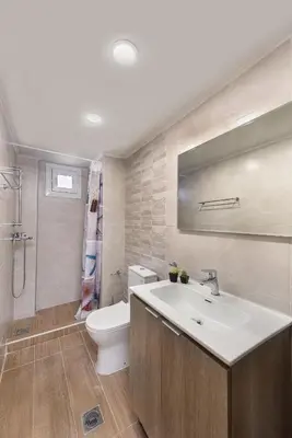 a bathroom with a sink and a toilet at Casa di Calma & Casa di Luce Rhodes Apartments in Rhodes Town