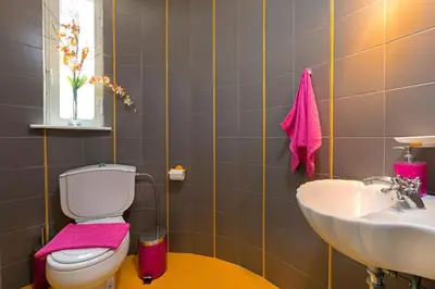 a bathroom with a toilet and a sink at Villa Dora in Faliraki