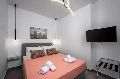 a bedroom with a bed with two towels on it at Nice n Cosy Apartment I in Rhodes Town