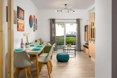 a dining room with a table and chairs at Nice n Cosy Apartment I in Rhodes Town