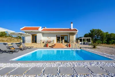 a villa with a swimming pool and a house at El Paradiso in Pastida
