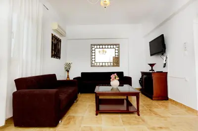 a living room with a couch and a table at Emerald Private Villa in Kalavarda Rhodes in Kalavárda