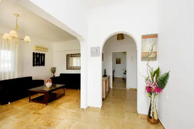 a living room with a couch and a table at Emerald Private Villa in Kalavarda Rhodes in Kalavárda
