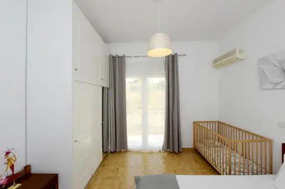 a bedroom with a bed and a sliding glass door at Emerald Private Villa in Kalavarda Rhodes in Kalavárda