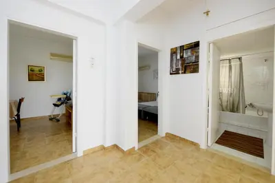 a room with white walls and a bathroom with a sink at Emerald Private Villa in Kalavarda Rhodes in Kalavárda