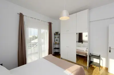 a bedroom with a white bed and a mirror at Emerald Private Villa in Kalavarda Rhodes in Kalavárda