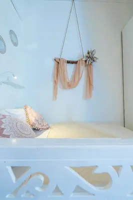 a bedroom with a bed with a curtain on it at SUN PETRADI Tradition & Luxury in Koskinou
