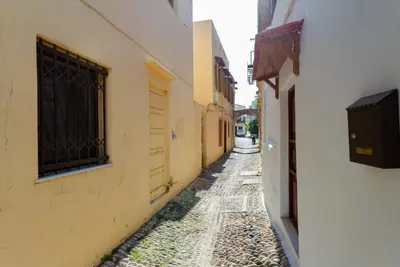 an alley between two buildings in an old town at Evaxenia's House Old Town Rhodes in Rhodes Town