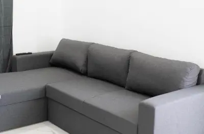 a gray couch sitting in a living room at Aegean Stars in Rhodes Town