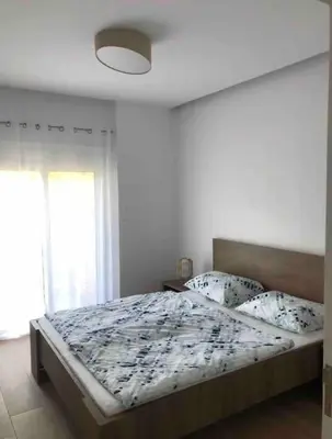 a bedroom with a bed and a window at Appartement in Rhodos Stadt in Rhodes Town