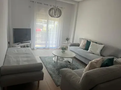 a living room with a couch and a table at Appartement in Rhodos Stadt in Rhodes Town
