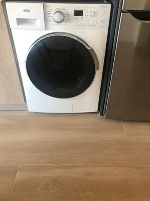 a microwave sitting in a kitchen next to a dishwasher at Appartement in Rhodos Stadt in Rhodes Town
