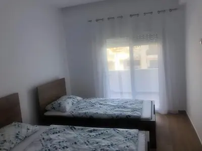 a bedroom with two beds and a window at Appartement in Rhodos Stadt in Rhodes Town
