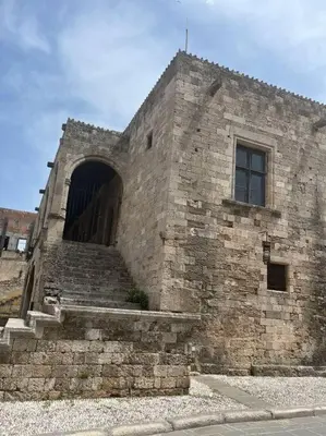 an old stone building with a large door and stairs at Appartement in Rhodos Stadt in Rhodes Town