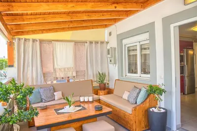 a living room with a couch and a table at Rhodian Filoxenia in Rhodes Town