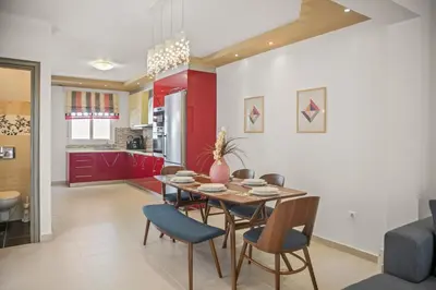 a kitchen and dining room with a table and chairs at Rhodian Filoxenia in Rhodes Town