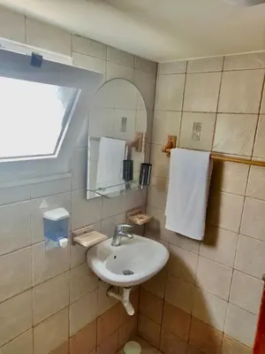 a bathroom with a sink and a mirror at Casa Amalia in Paradeísion