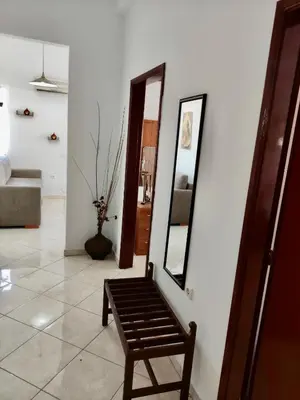 a mirror and a chair in a room at Casa Amalia in Paradeísion