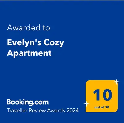 a yellow sign with the text awarded to evlyns cozy apartment at Evelyn's Cozy Apartment in Rhodes Town