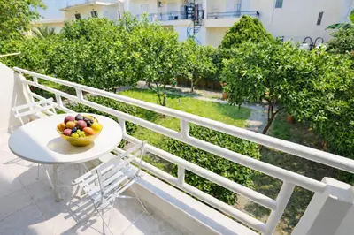 a bowl of fruit on a table on a balcony at Casa al' Tati Apartments in Ialyssos