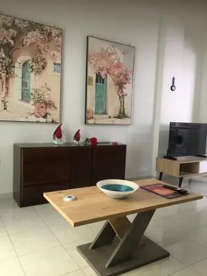 a room with a table with a bowl on it at Emerald Cozy Apartment in Rhodes Town