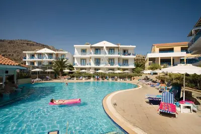 a pool with a person in a raft in the water at Pefki Islands in Pefki Rhodes