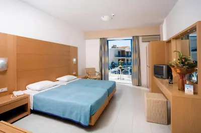 a hotel room with a bed and a balcony at Pefki Islands in Pefki Rhodes