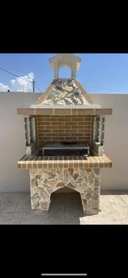 an outdoor brick oven sitting on a patio at Anastasia Luxury House in Afantou