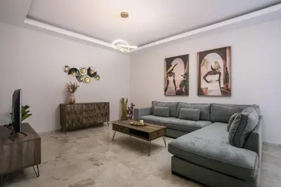 a living room with a couch and a table at Anastasia Luxury House in Afantou