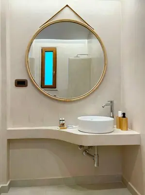 a bathroom with a sink and a mirror at Alindo Villa II, in Lindos area in Líndos
