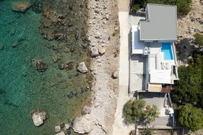 an aerial view of the beach and the ocean at Hamilton Sea Front Villa in Archangelos