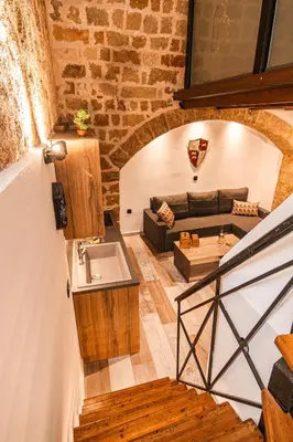 a living room with a couch and a sink at Inverno Medieval apartment in Rhodes Town