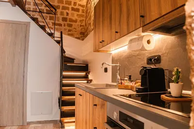a kitchen with a sink and a counter top at Inverno Medieval apartment in Rhodes Town