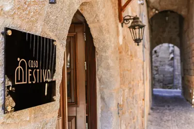an entrance to a building with a sign on it at Medieval apartment Estiva in Rhodes Town