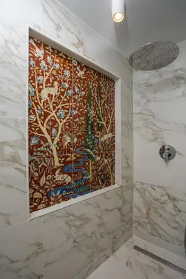 a bathroom with a large painting on the wall at Rodi Luxury Apartment in Rhodes Town