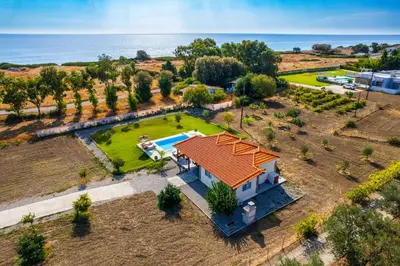 an aerial view of a house with a swimming pool at Kalimera Villa By the Sea in Gennadi