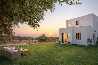a villa with a view of the sunset at Exclusive Olive & Herb Villa, Mountain to Sea Views, Rhodes in Afantou