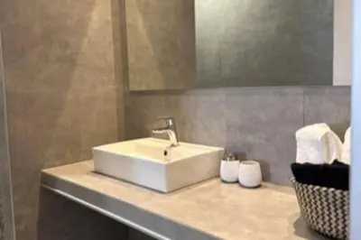 a bathroom with a white sink and a mirror at Nirea studio in Faliraki Rhodes in Faliraki