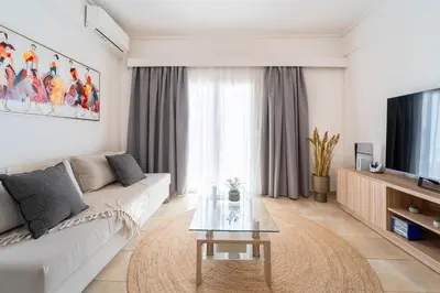 a living room with a couch and a coffee table at Residence City Apartment in Rhodes Town