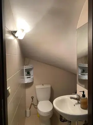 a bathroom with a toilet and a sink at John's house in Rhodes Town