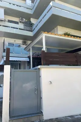 a building with a door in front of a building at John's house in Rhodes Town
