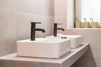 two sinks on a counter in a bathroom at Lemontrees Residences in Rhodes Town
