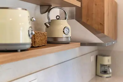 a tea kettle sitting on a shelf in a kitchen at Lemontrees Residences in Rhodes Town
