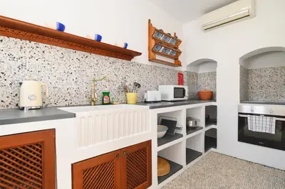 a kitchen with a sink and a counter at Villa Nouna in Líndos
