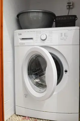 a white washing machine with a bowl on top of it at Villa Nouna in Líndos