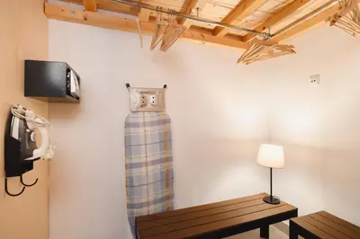 a room with a table and a clock on the wall at Villa Nouna in Líndos