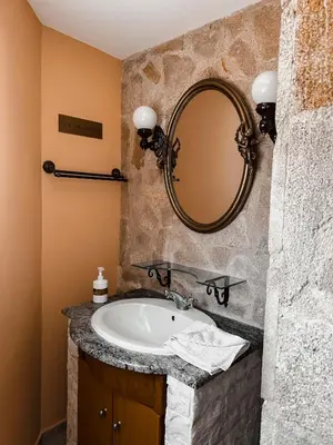 a bathroom with a sink and a mirror at Theonia Villas in Pefki Rhodes