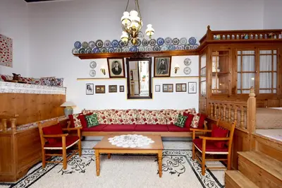 a living room with a couch and a table at Villa Annoula - Traditional Lindian House in Líndos